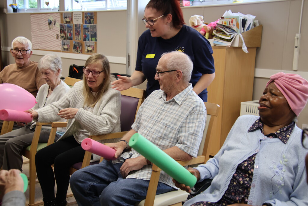 People who attend Day Break playing a game of hit the balloon.